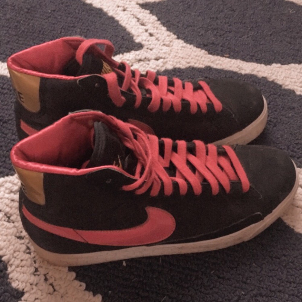 Black and pink Nike high top sneakers